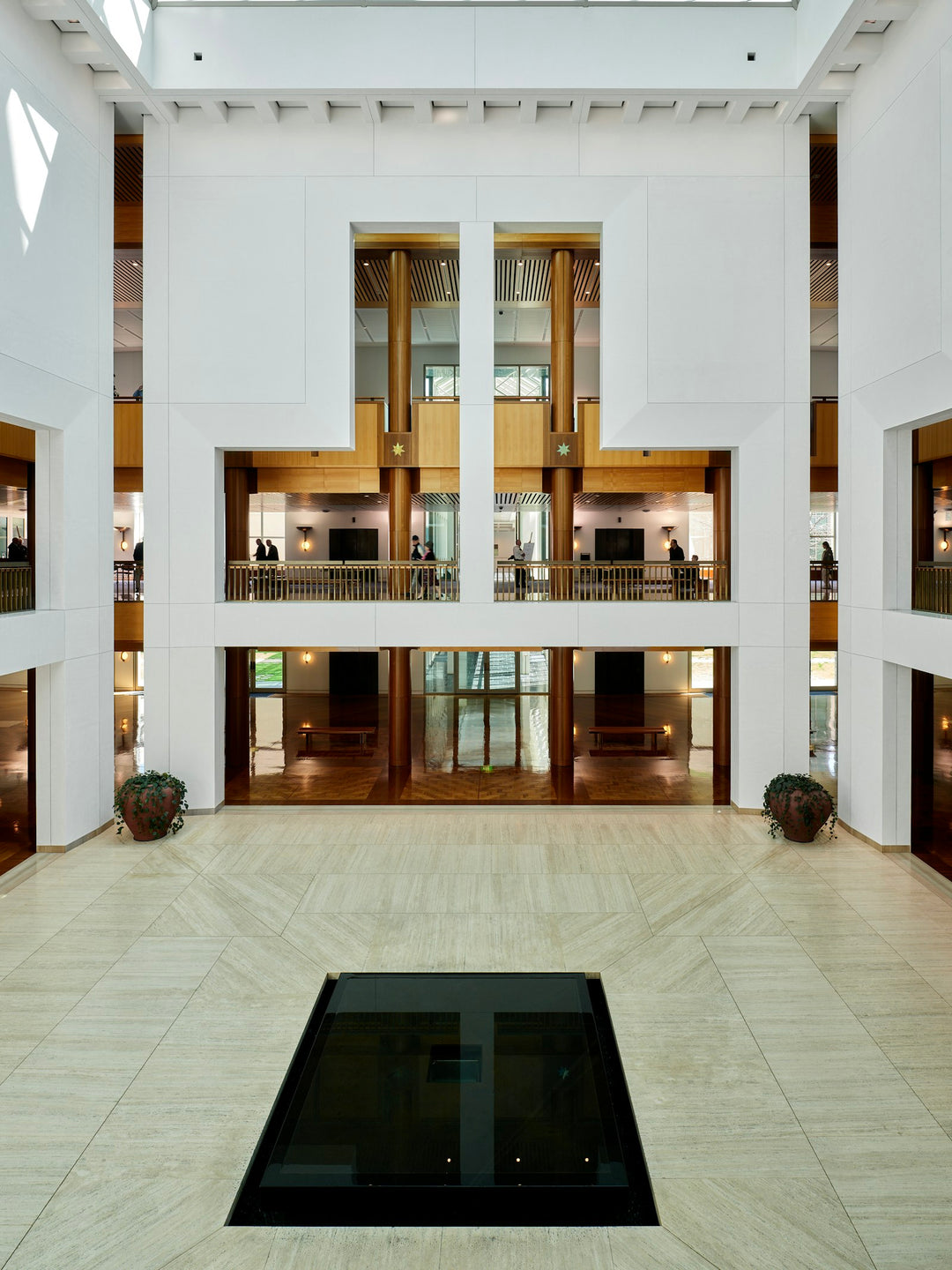 Spacious modern building interior with atrium and natural light — cruise / hospitality